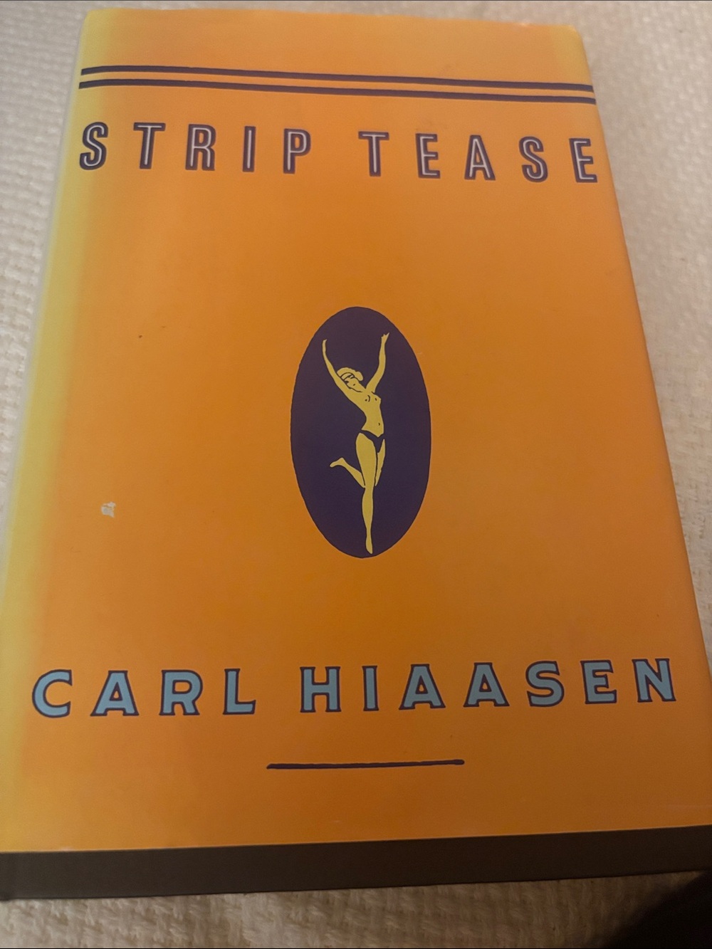 Strip Tease, a satirical crime novel by bestselling author Carl Hiaasen